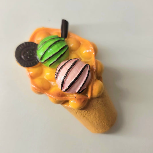 Double scoop ice cream magnet close-up showing detailed waffle cone texture and creamy scoops