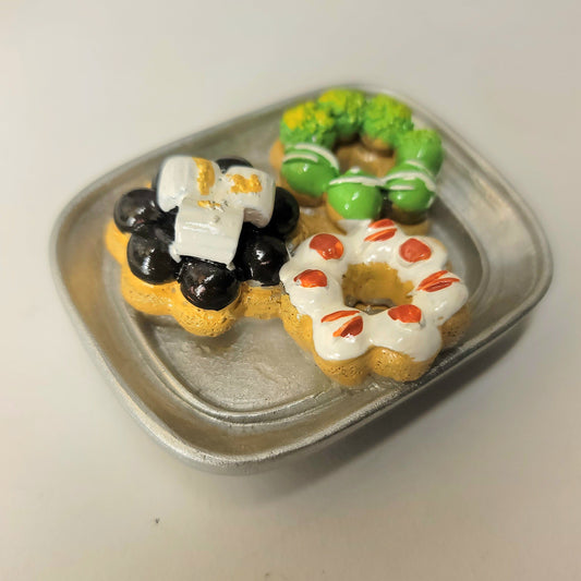 Mochi donuts magnet close-up showing detailed frosting, sprinkles and unique bubble texture