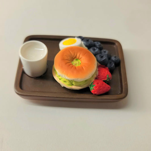 Bagel magnet close-up showing detailed cream cheese, toppings and authentic bagel texture