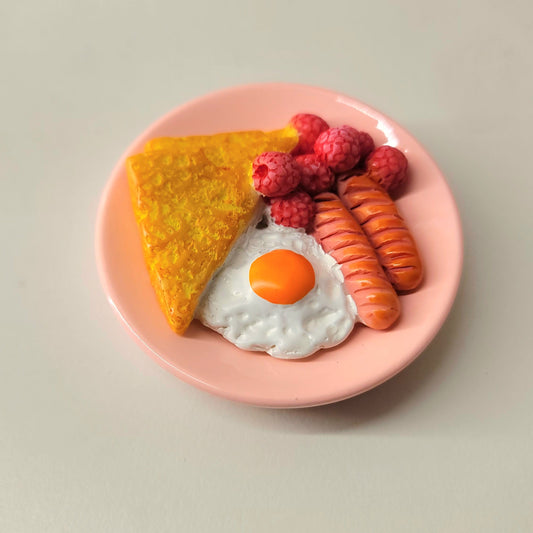 French toast magnet close-up showing detailed golden bread, butter and syrup presentation