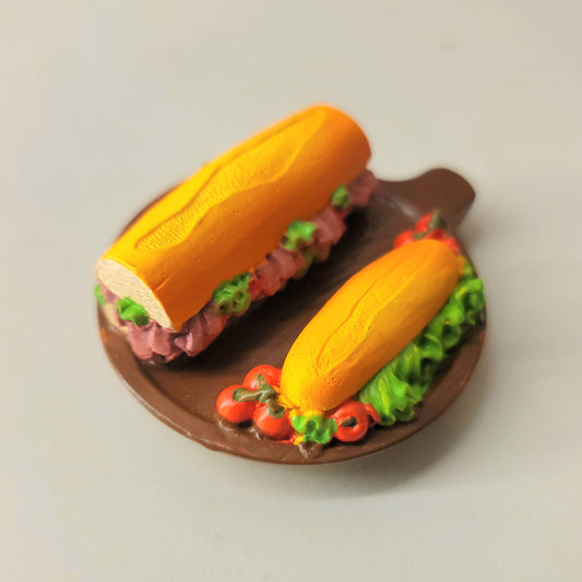 Sub sandwich magnet close-up showing detailed lettuce, meat and bread layers