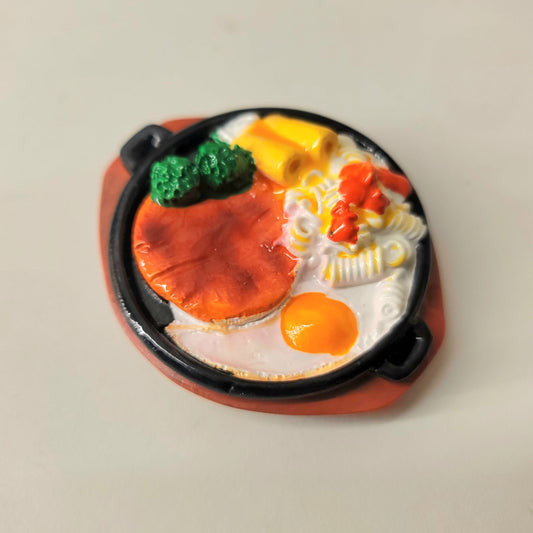 Steak and eggs magnet close-up showing detailed meal presentation and appetizing design