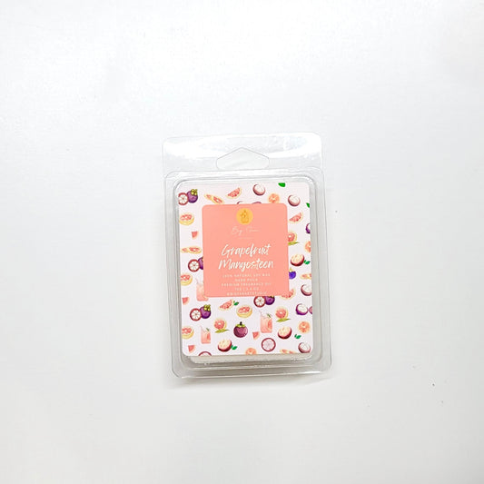 Grapefruit mangosteen wax melt close-up showing vibrant color and exotic fruit fragrance