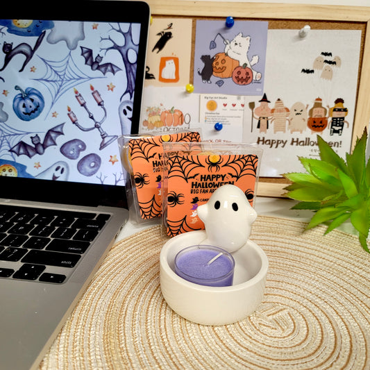 Little ghost tealight set close-up showing adorable faces and charming Halloween character appearance