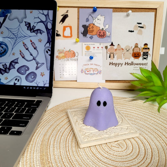 Colorful Halloween ghost candles showing Pumpkin Chai, Boba Tea and Lychee Jelly scent options