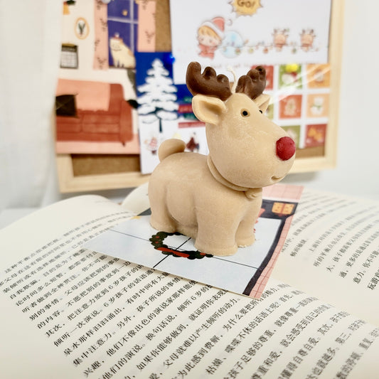 Reindeer candle close-up showing detailed antlers and cute holiday character appearance