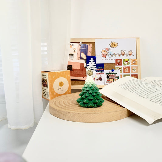 Christmas tree candle close-up showing detailed ornaments and authentic holiday tree appearance