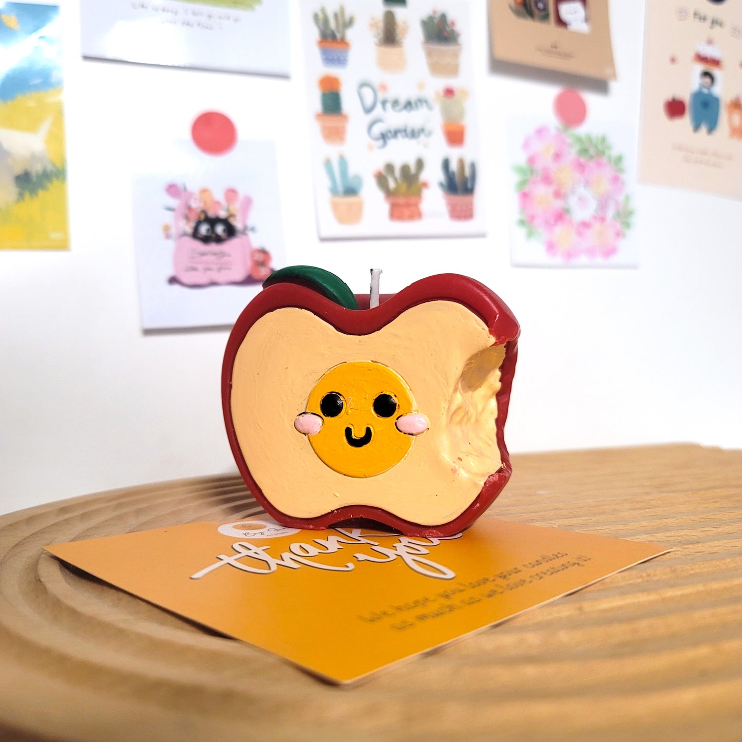 Handcrafted apple buddy candle, playful cute-themed decorative wax art piece