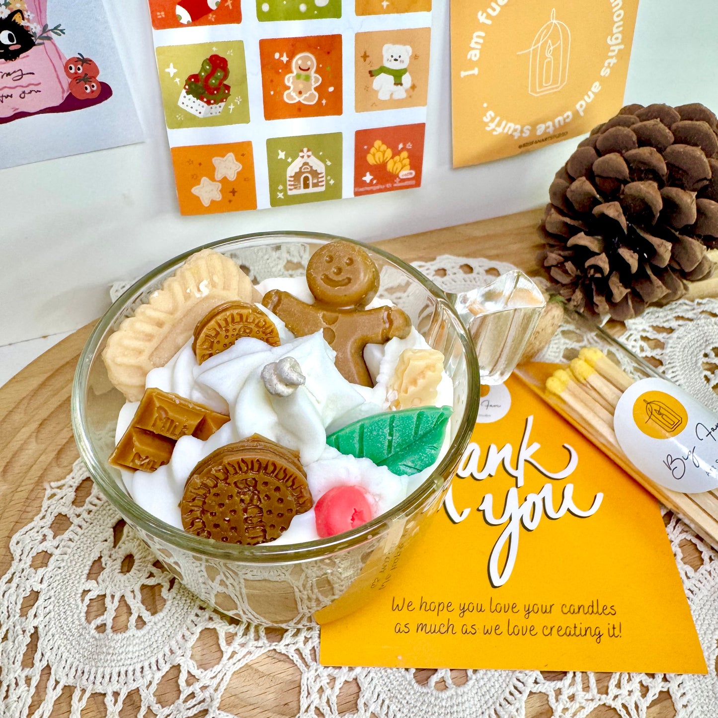 Winter hot chocolate candle in cozy setting with blankets and warm decor