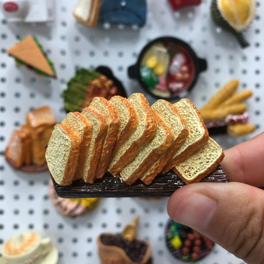 Sliced bread magnet close-up showing detailed crust and fluffy bread interior