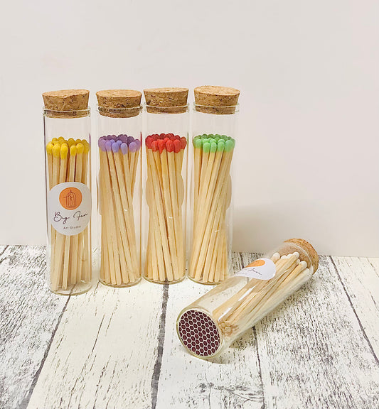 Decorative matchstick jar close-up showing detailed glass and elegant label appearance