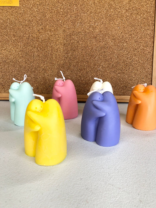 Hugging ghost candle close-up showing sweet faces and charming Halloween character appearance