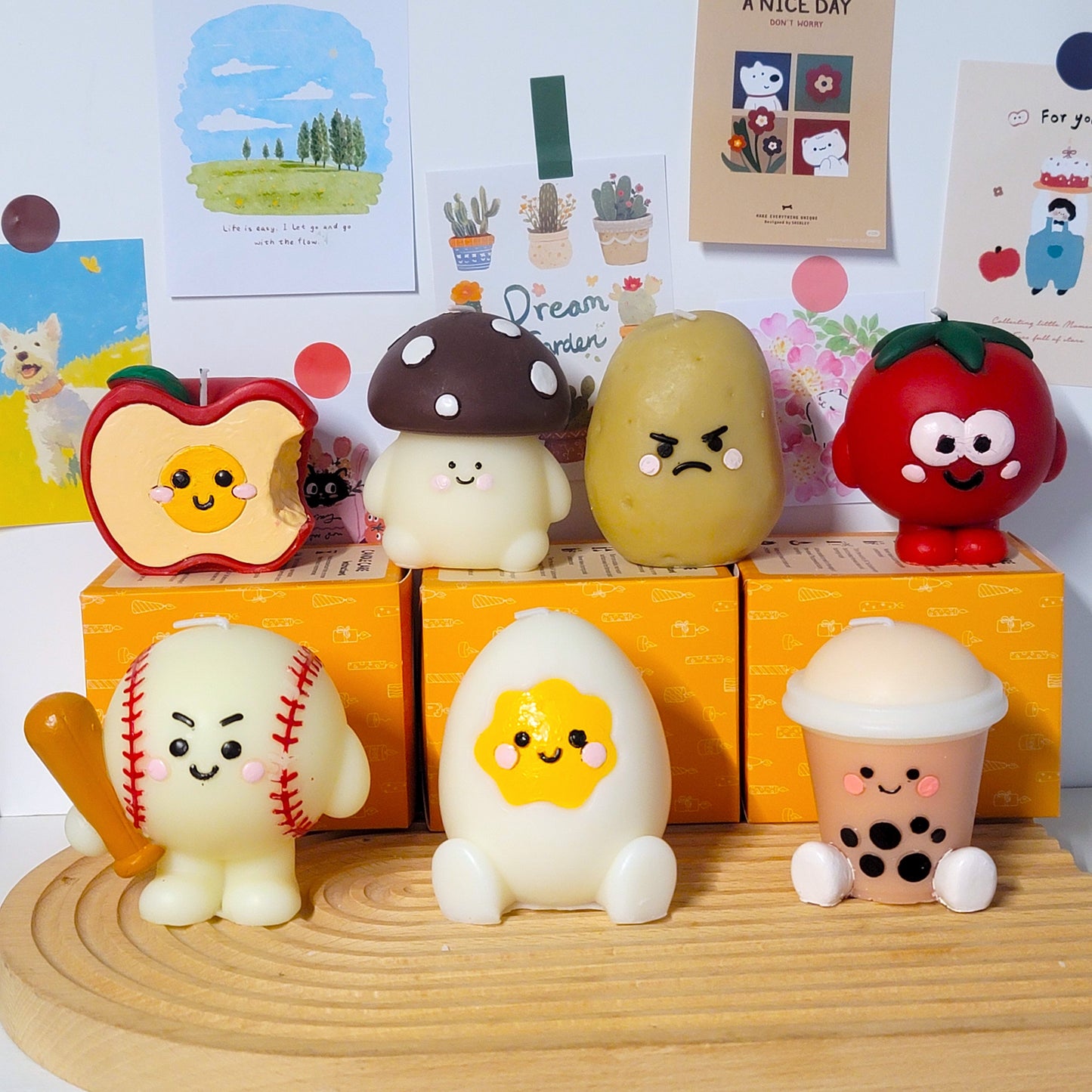 Eggplant buddy candle collection display with multiple adorable decorative wax art pieces