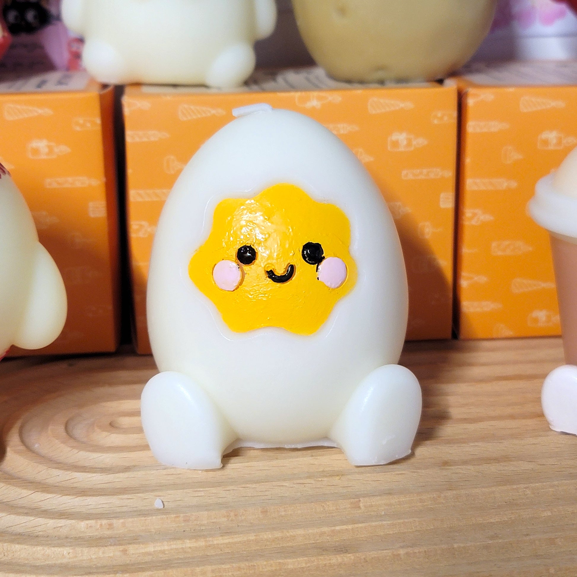 Egg buddy candle with adorable smiling design, cute character sculptural soy wax decor