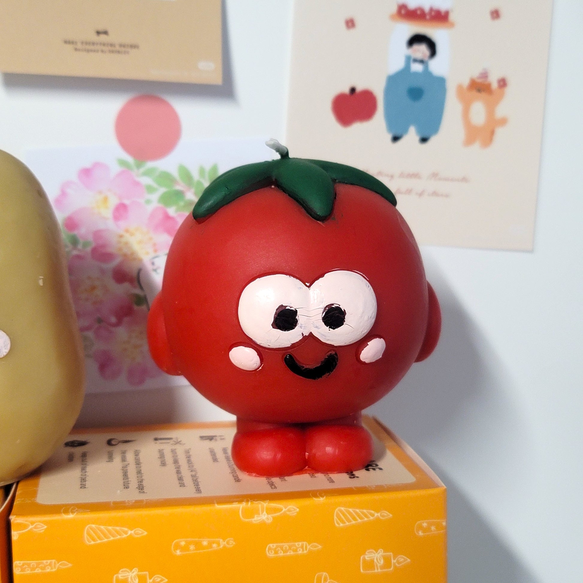 Tomato buddy candle close-up showing sweet face and charming kawaii appearance