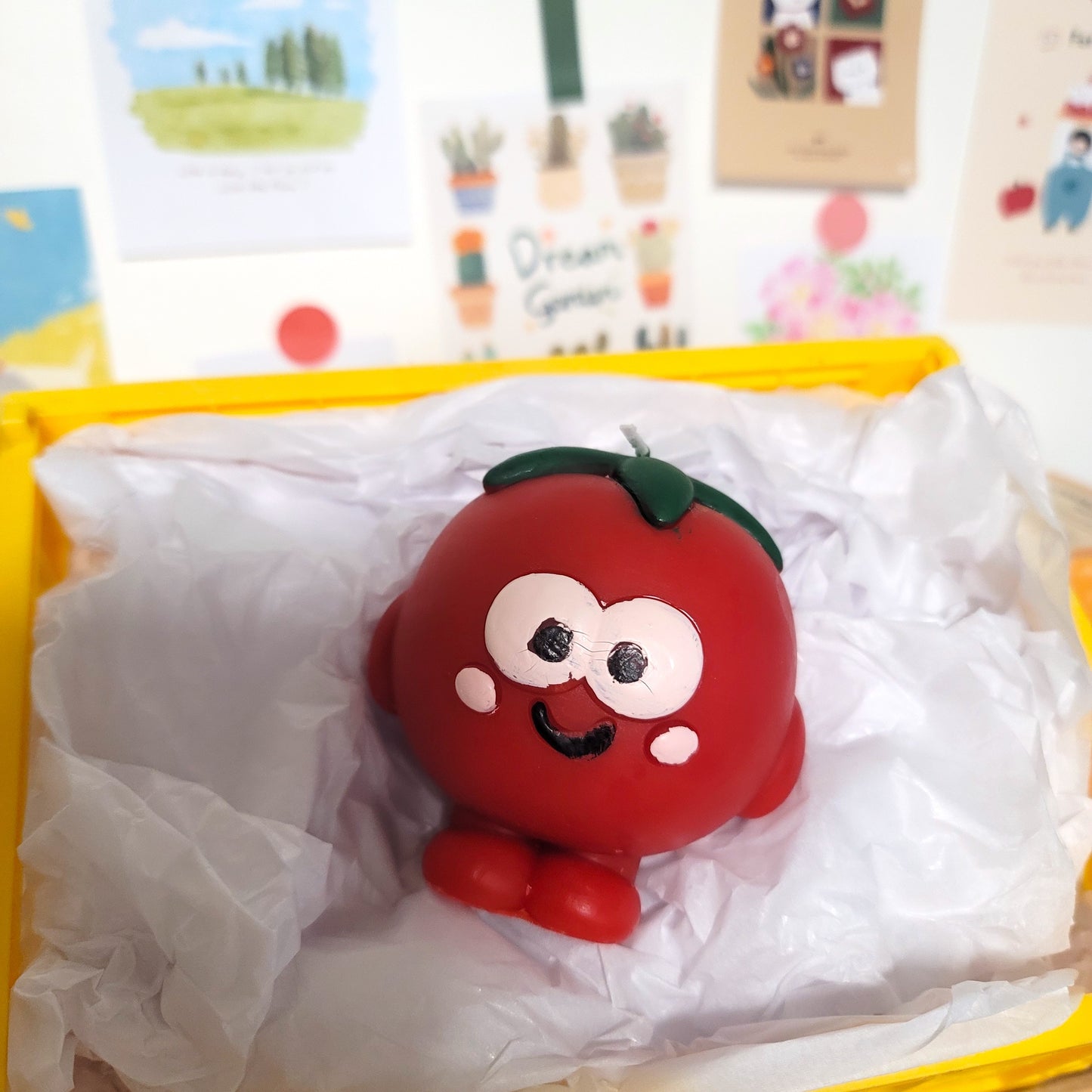 Tomato buddy candle lifestyle shot, whimsical home decor accent