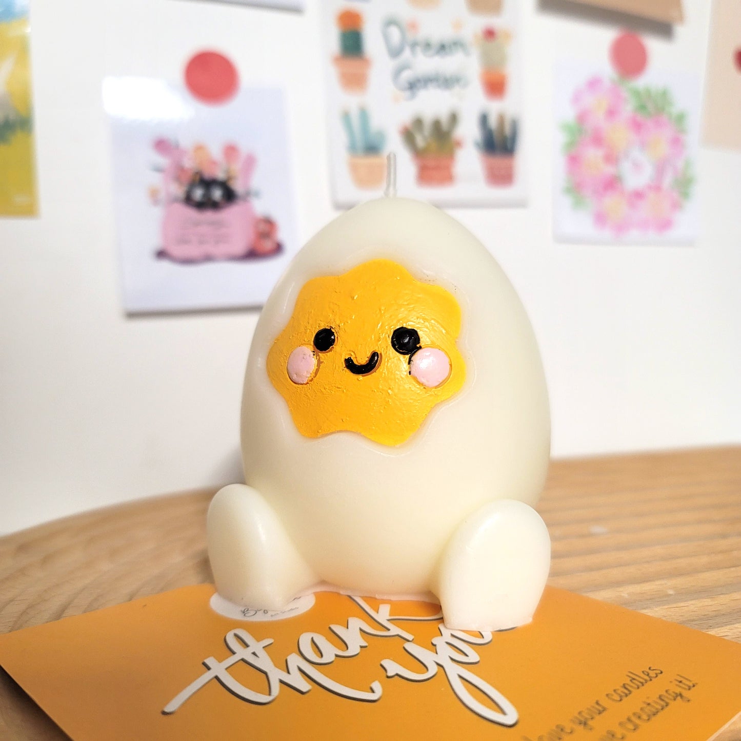 Handcrafted egg buddy candle, playful cute-themed decorative wax art piece