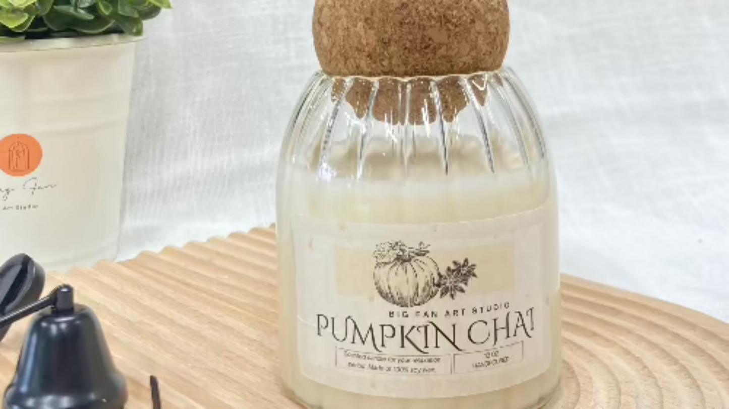 Close-up of the Signature Jar Candle, showing the charming wood cork lid on a living room table.