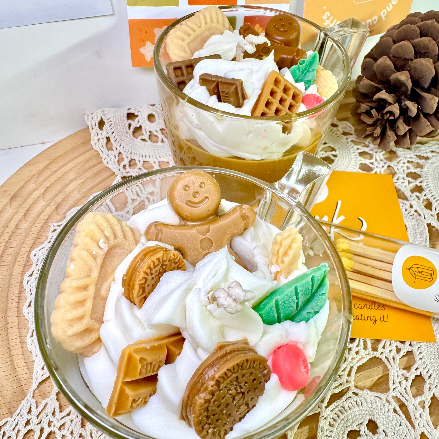 Hot cocoa candle burning with warm glow, perfect for winter comfort